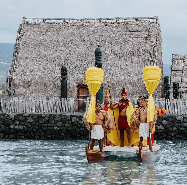 The Royal Court arriving by canoe at the Island Breeze Luau